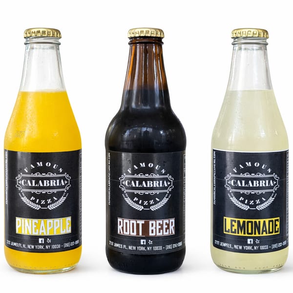 Three Famous Calabria Pizza bottled beverages: Pineapple, Root Beer, and Lemonade, against a white background.